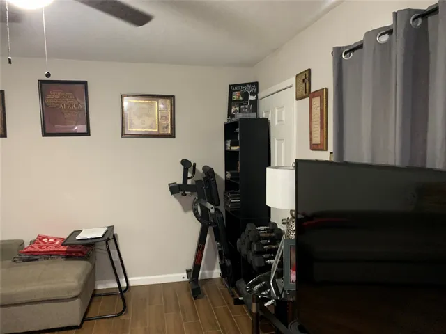 a view of bedroom and hallway