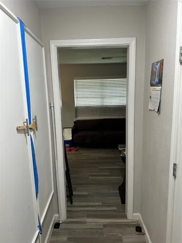 a bedroom with furniture and wooden floor