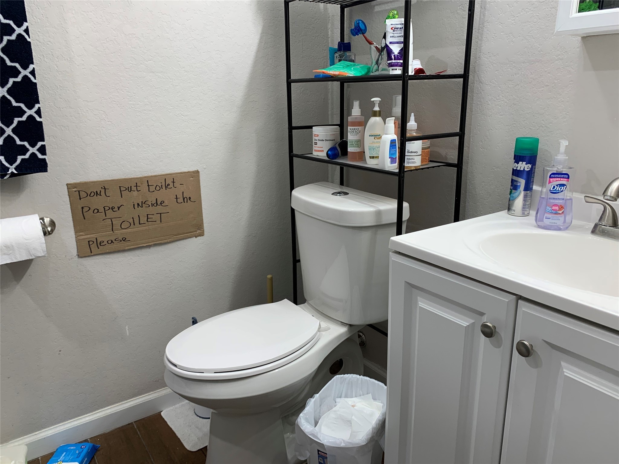 2922 Randolph Road Pasadena, TX 77503 - Photo 49 of 50 a white toilet sitting next to a bathroom sink