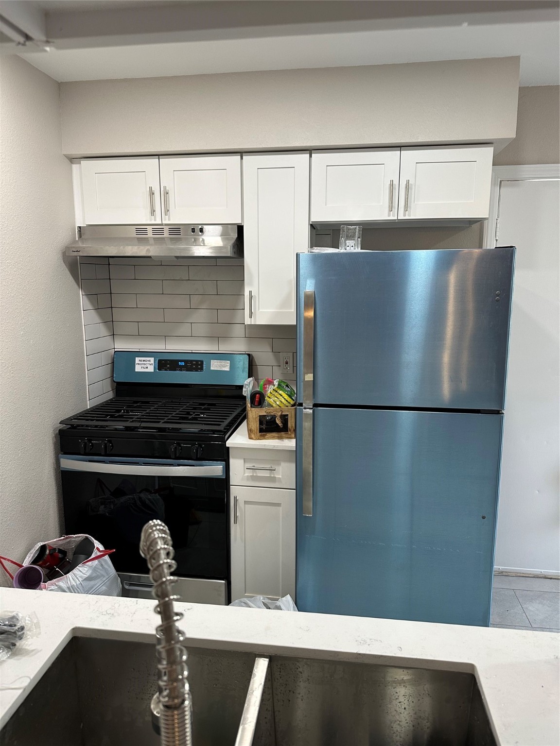 2922 Randolph Road Pasadena, TX 77503 - Photo 7 of 50 a close view of a stove top oven and refrigerator