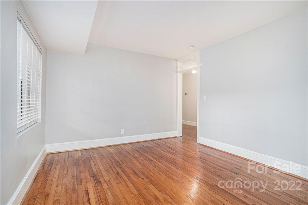 230 Providence Road Charlotte, NC 28207 - Photo 12 of 29 a view of an empty room with wooden floor