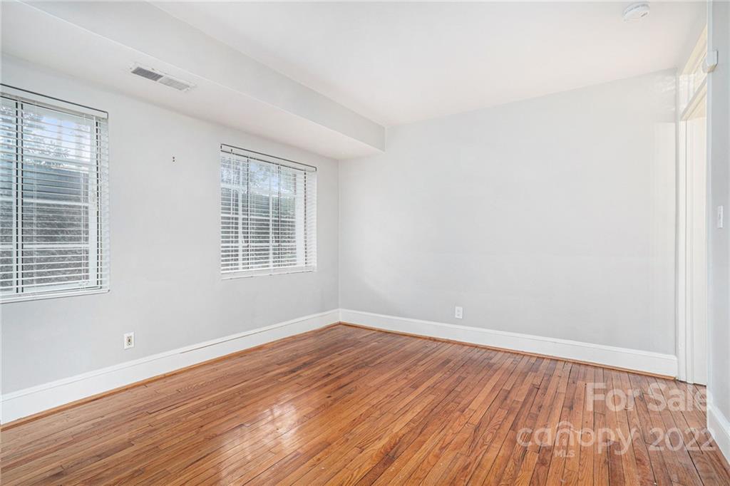 230 Providence Road Charlotte, NC 28207 - Photo 13 of 29 wooden floor in an empty room with a window
