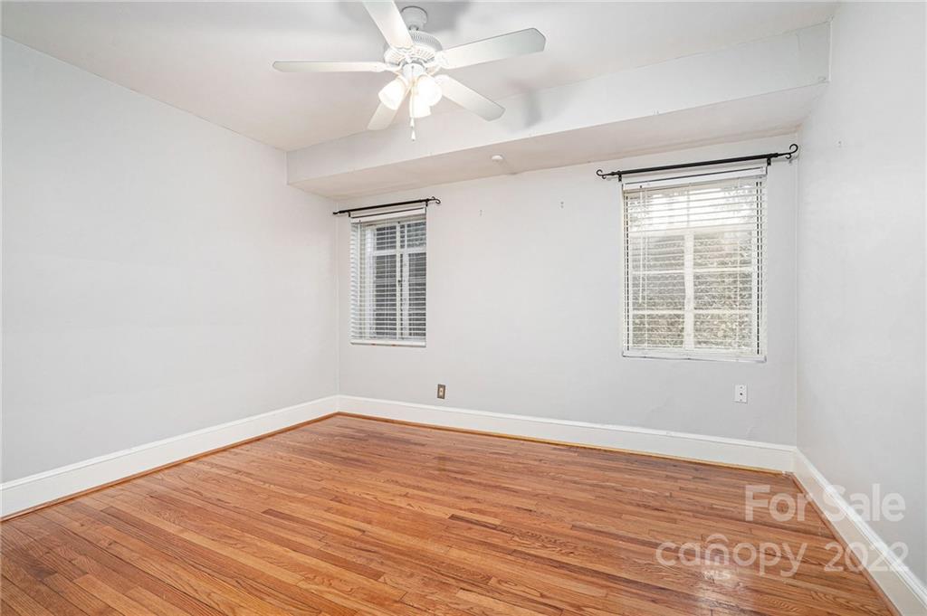 230 Providence Road Charlotte, NC 28207 - Photo 17 of 29 wooden floor in an empty room with a window