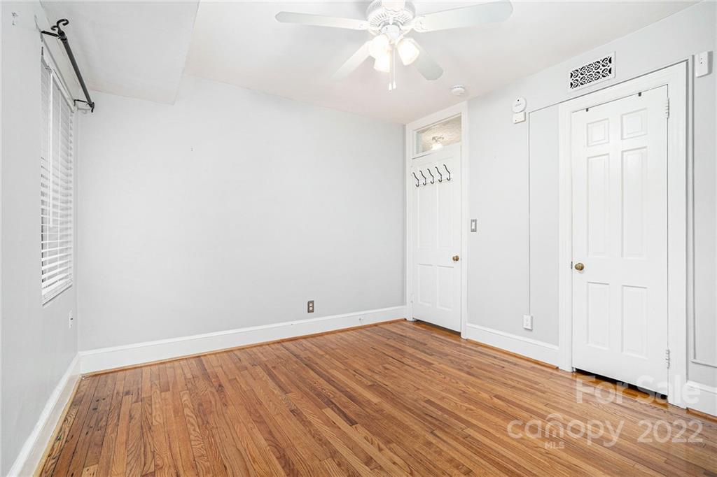 230 Providence Road Charlotte, NC 28207 - Photo 18 of 29 a view of an empty room with wooden floor