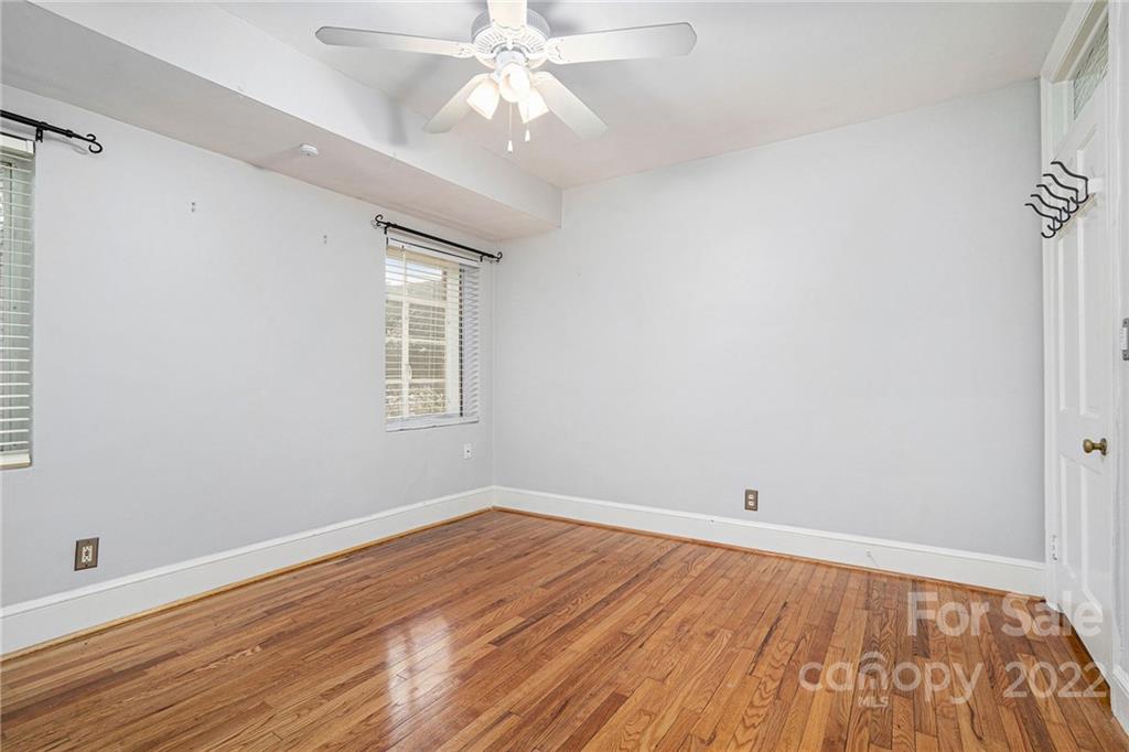 230 Providence Road Charlotte, NC 28207 - Photo 19 of 29 wooden floor in an empty room with a window