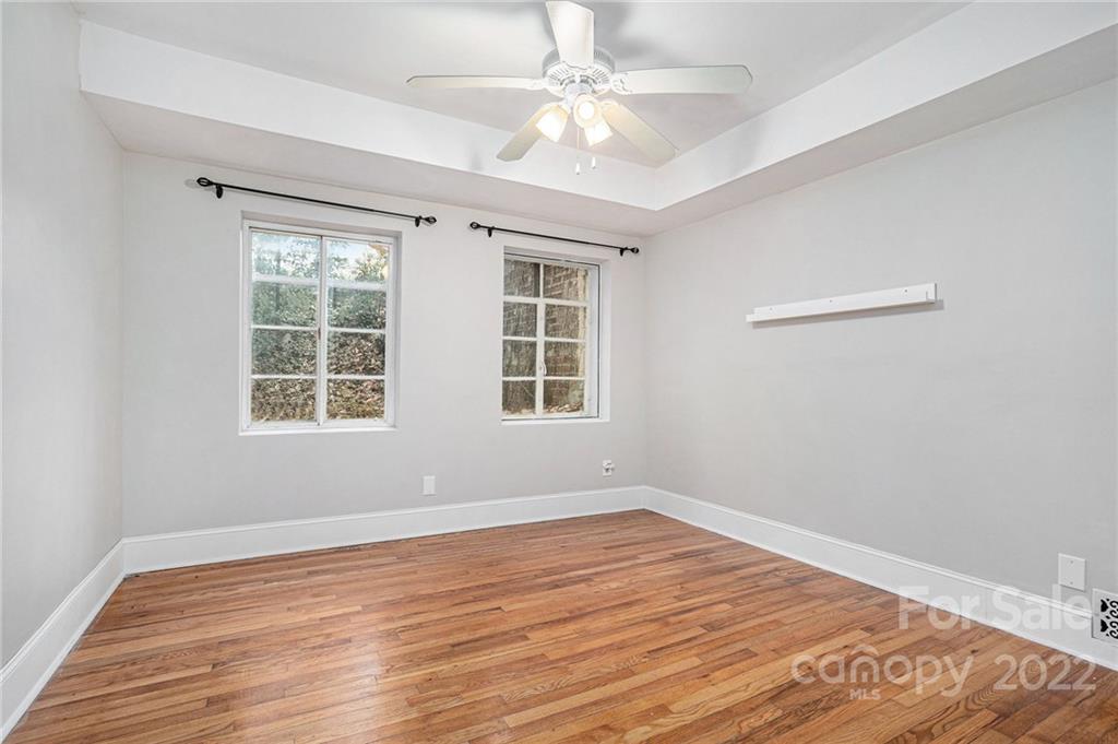 230 Providence Road Charlotte, NC 28207 - Photo 20 of 29 a view of empty room with wooden floor and fan