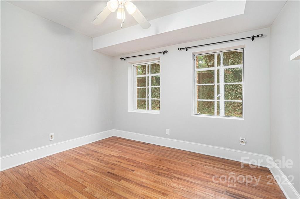 230 Providence Road Charlotte, NC 28207 - Photo 21 of 29 a view of empty room with wooden floor and fan