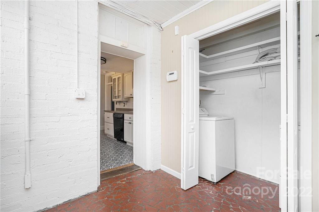 230 Providence Road Charlotte, NC 28207 - Photo 3 of 29 a view of a hallway with wooden shelves