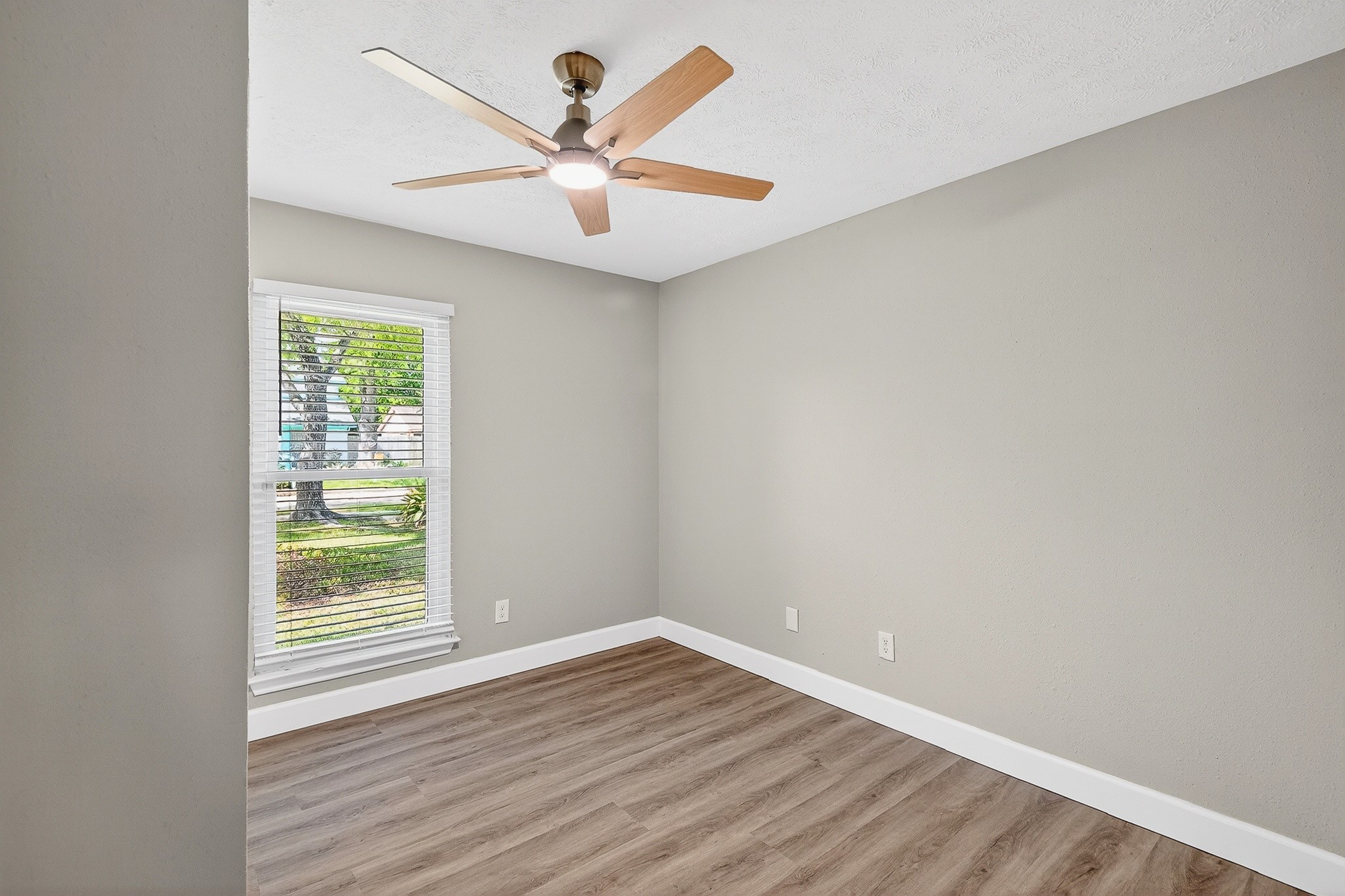 2510 Marble Falls Drive Spring, TX 77373 - Photo 10 of 26 an empty room with wooden floor and windows