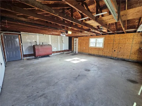 a view of a room with wooden walls