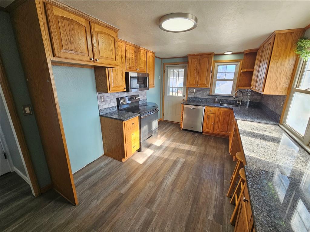908 New Castle Road Butler, PA 16001 - Photo 3 of 23 a view of kitchen and dining room with wooden floor