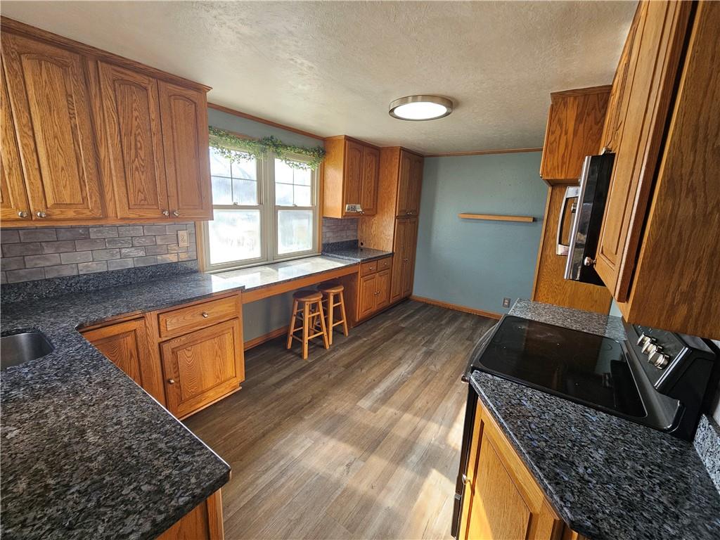 908 New Castle Road Butler, PA 16001 - Photo 4 of 23 a kitchen with sink window and cabinets
