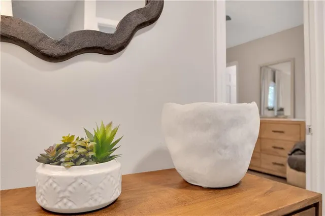 a view of a vase of flowers sitting on a table