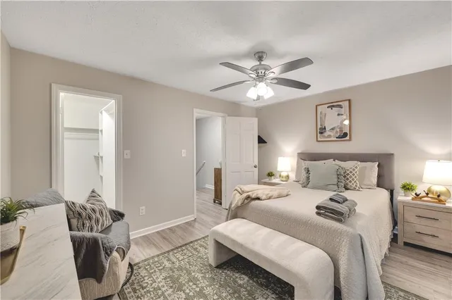 a bedroom with a bed couch and a window