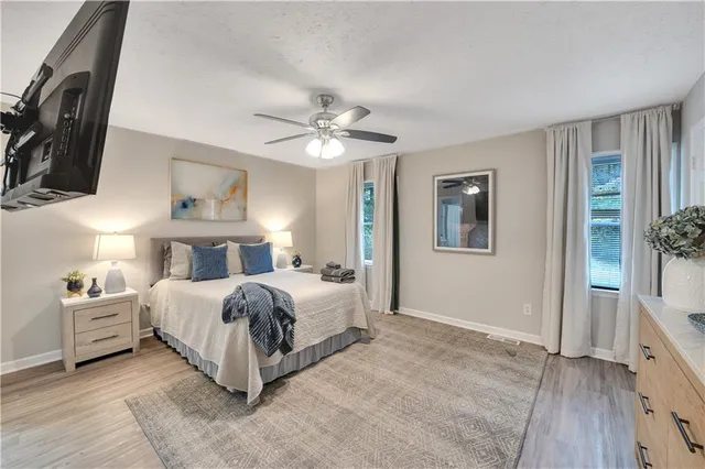 a bed room with a bed and a chandelier