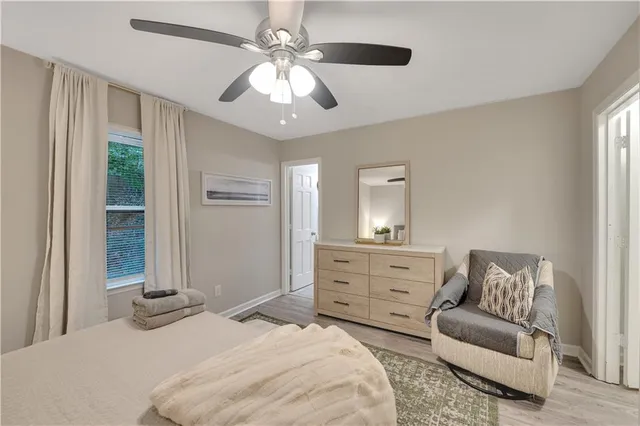 a bedroom with a bed and a couch