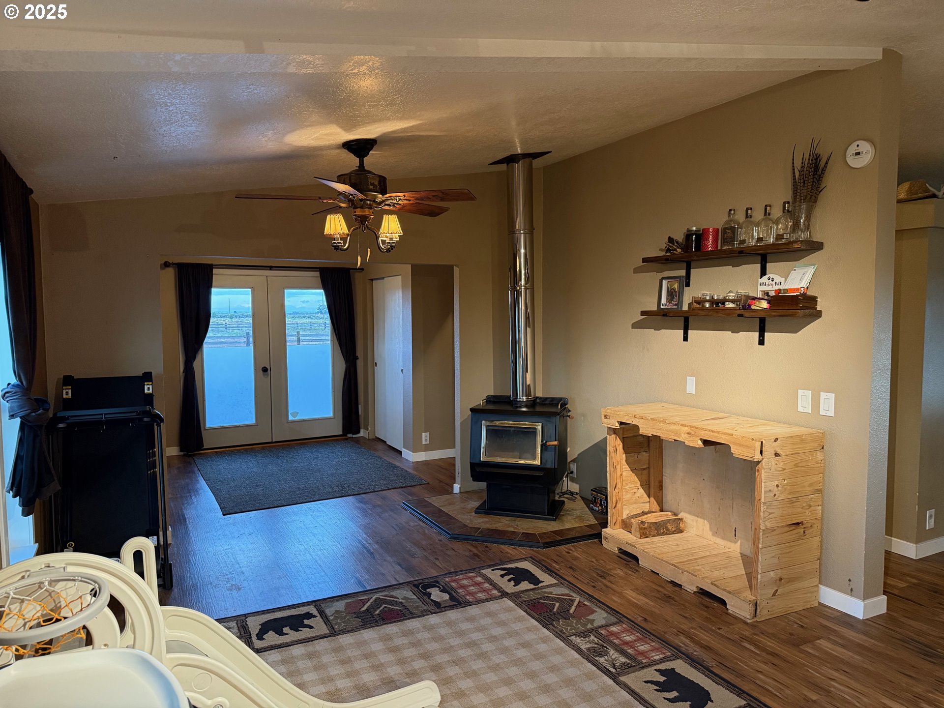 87479 North Star Lane Christmas Valley, OR 97641 - Photo 8 of 30 a living room with furniture and a chandelier