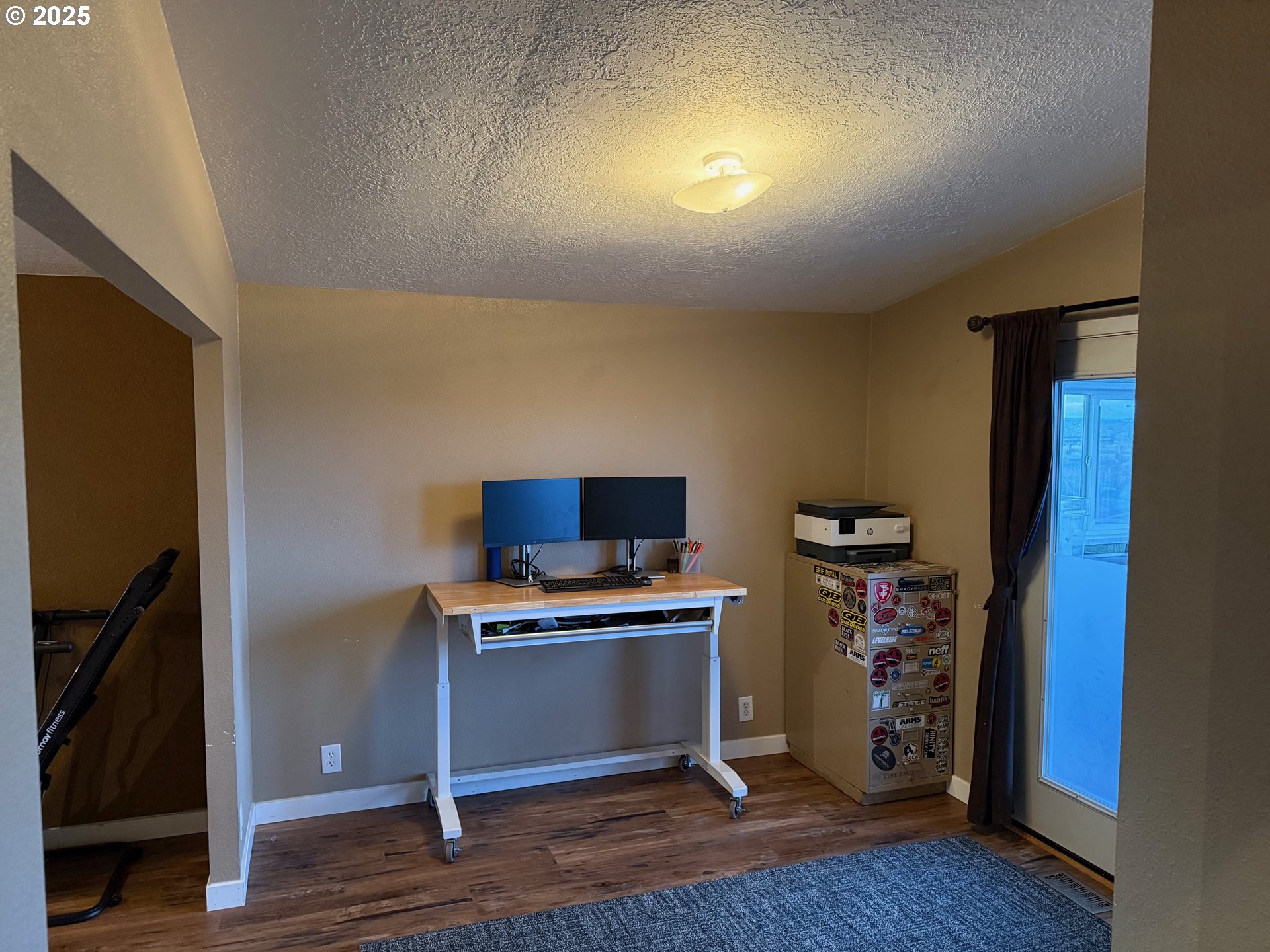 87479 North Star Lane Christmas Valley, OR 97641 - Photo 9 of 30 a view of a workspace with furniture and wooden floor