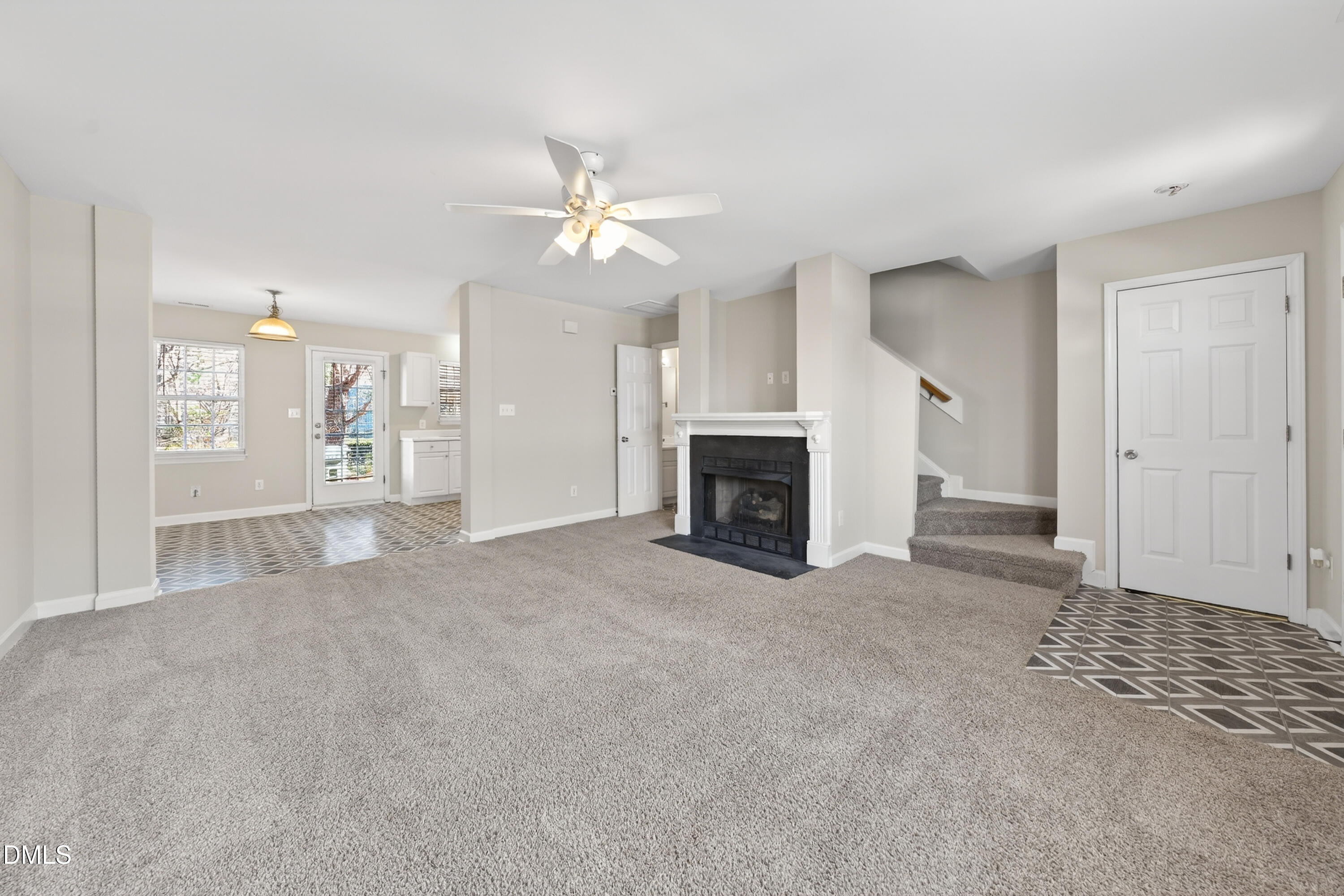 1601 Briarmont Court Raleigh, NC 27610 - Photo 9 of 30 an empty room with windows and fireplace