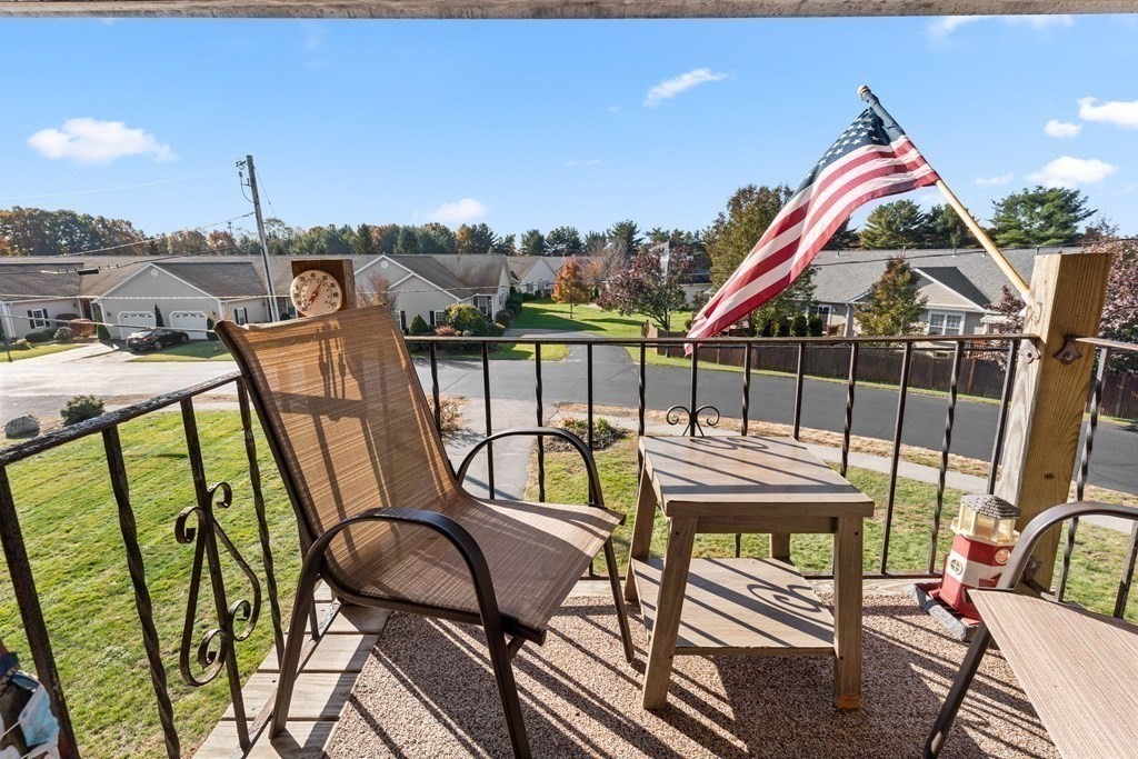 18 Woodman Way, Unit 17 Newburyport, MA 01950 - Photo 2 of 24 a view of a chairs and table in the balcony