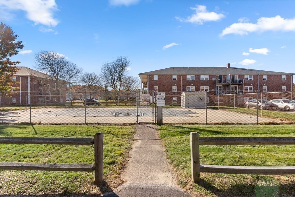 18 Woodman Way, Unit 17 Newburyport, MA 01950 - Photo 21 of 24 a view of a swimming pool with a garden