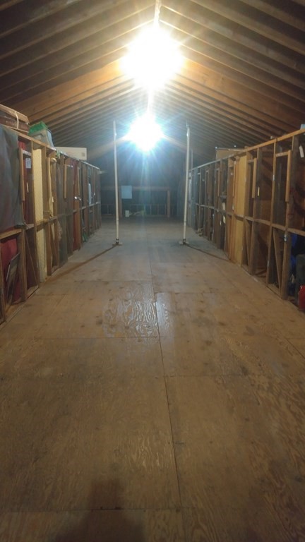 18 Woodman Way, Unit 17 Newburyport, MA 01950 - Photo 23 of 24 a view of an empty room with wooden floor