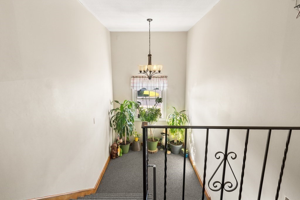 18 Woodman Way, Unit 17 Newburyport, MA 01950 - Photo 3 of 24 a view of a entryway door with flower pot