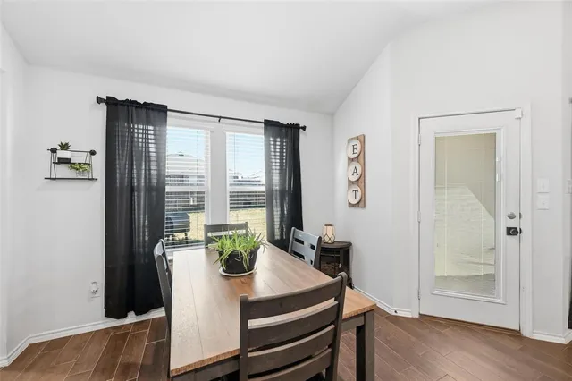 a kitchen with granite countertop a sink dishwasher stove and microwave with wooden cabinets