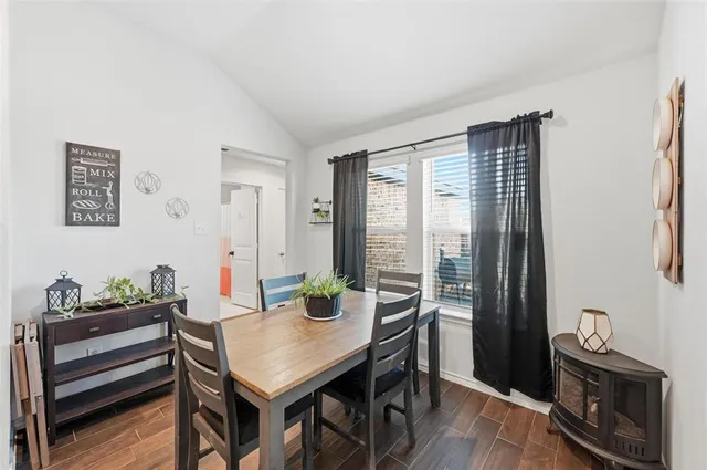 a view of kitchen with microwave stove top oven and cabinets