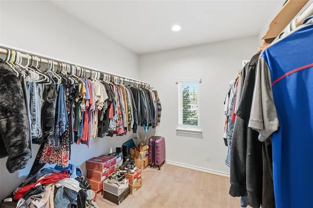 a bedroom with bed and a large mirror