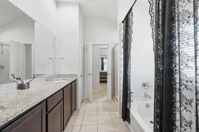 a bedroom with a bed and cabinets