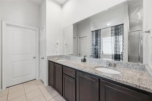 a view of walk in closet with clothes