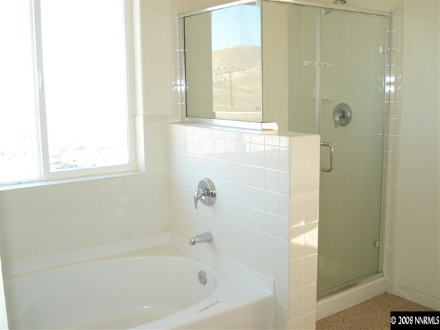 1597 Orca Way Reno, NV 89506 - Photo 7 of 9 a bathroom with a bathtub