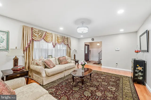 a living room with furniture and a rug