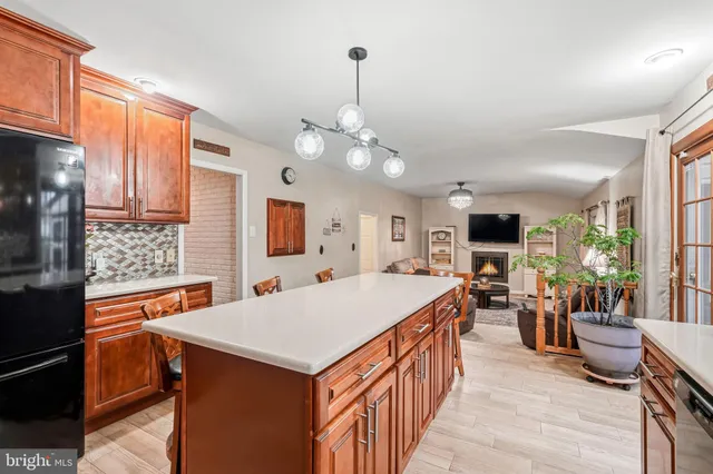 a large kitchen with a table and chairs in it