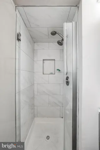 a bathroom with a shower and a toilet