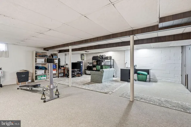 a room with lots of table and chairs