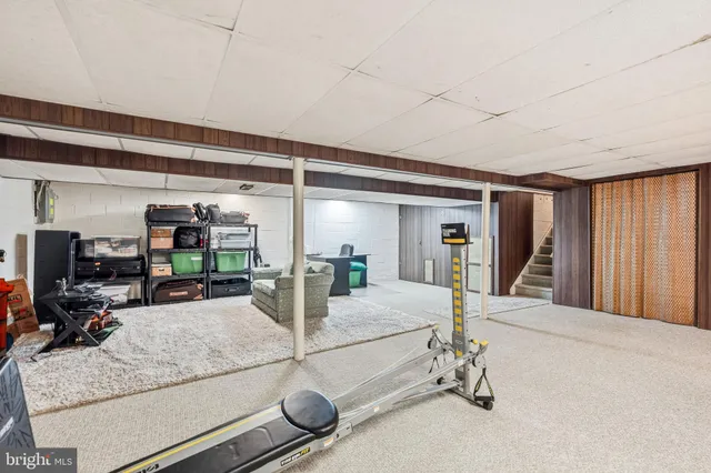 a room with gym equipment and a large window