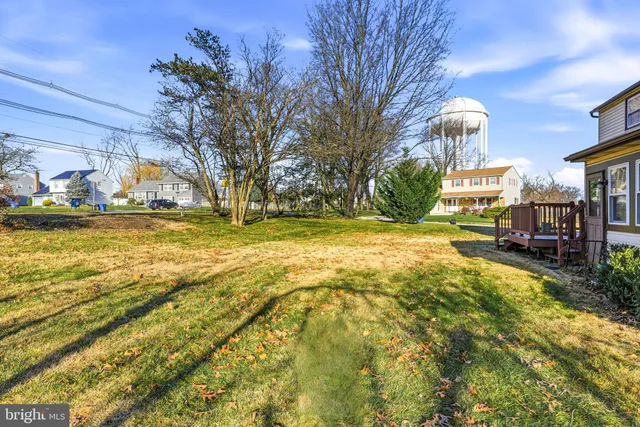 a view of a yard with swimming pool