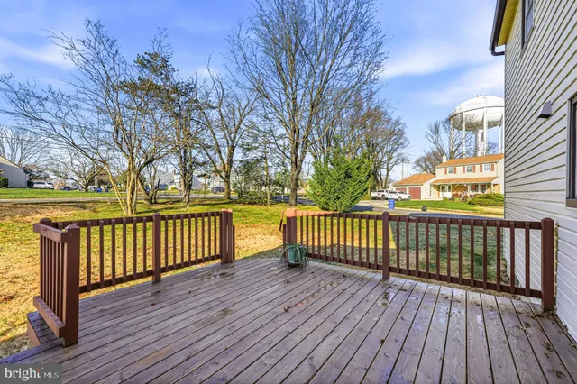 a view of a wooden deck with trees