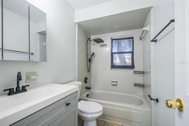 a bathroom with a sink a toilet and a bathtub