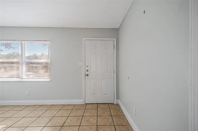a view of an empty room and window