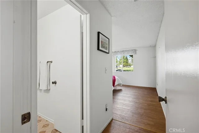 a view of an entryway with wooden floor