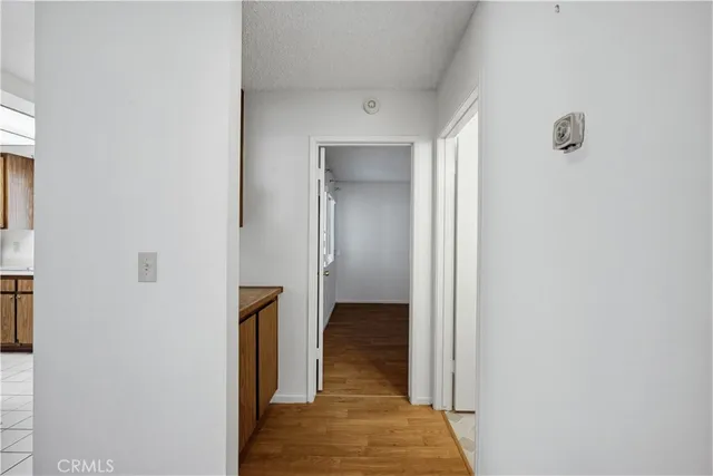 a view of hallway with wooden floor