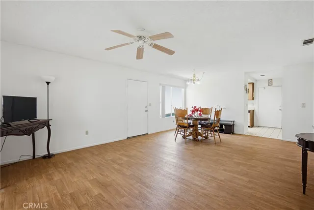 a view of a work space with furniture and a window