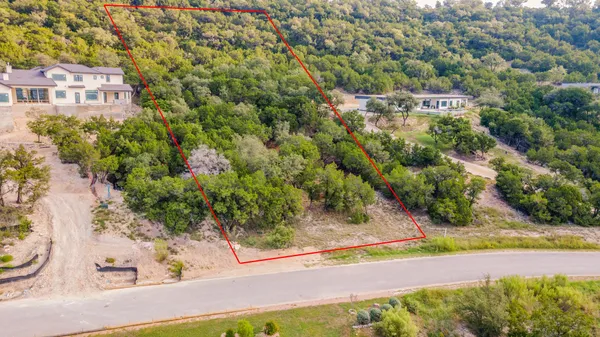 an aerial view of a house with yard