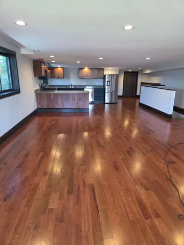 a view of lobby with furniture and wooden floor