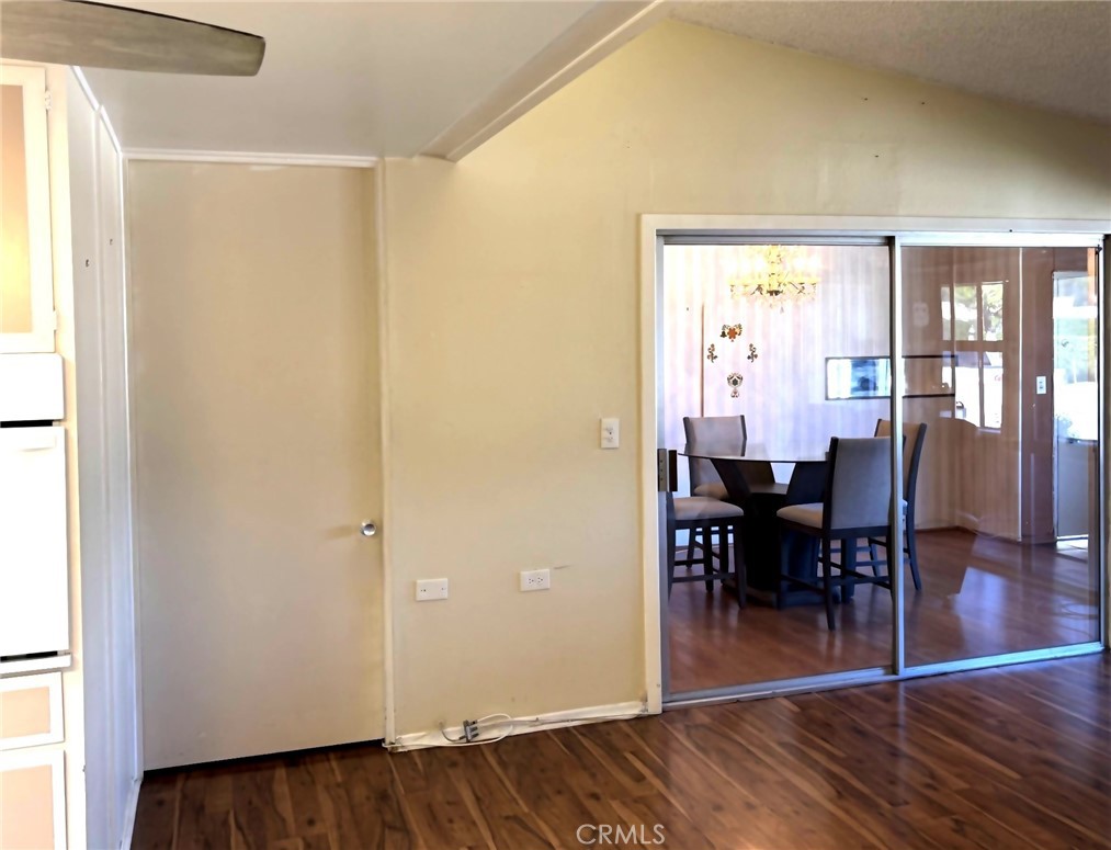 1075 Brookline Road, Unit M9220E Seal Beach, CA 90740 - Photo 12 of 16 a view of a dining room with furniture and wooden floor