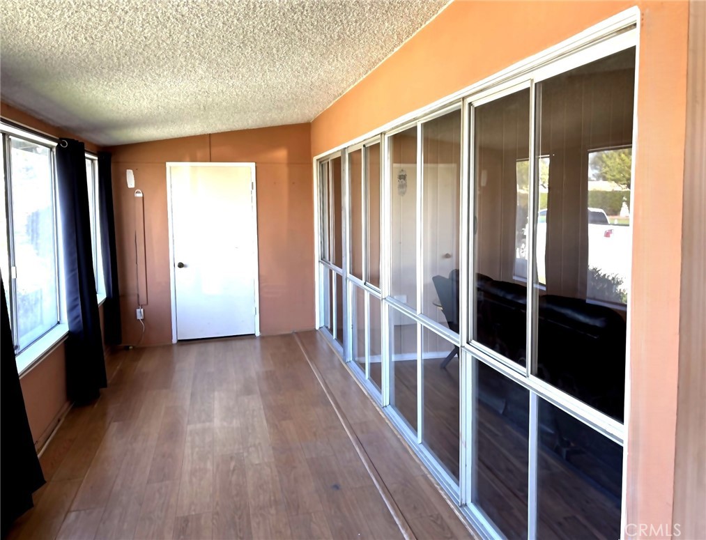 1075 Brookline Road, Unit M9220E Seal Beach, CA 90740 - Photo 2 of 16 a view of staircase with wooden floor and fence