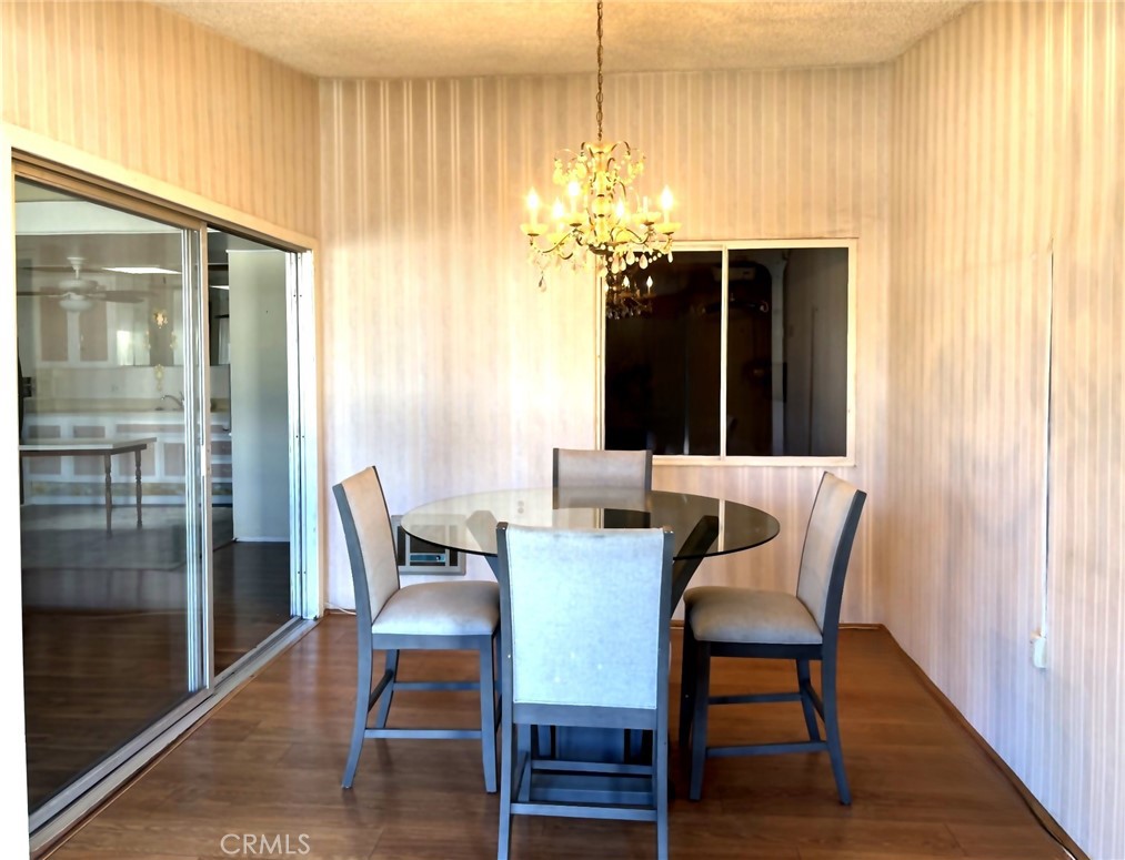 1075 Brookline Road, Unit M9220E Seal Beach, CA 90740 - Photo 4 of 16 a view of a dining room with furniture and window